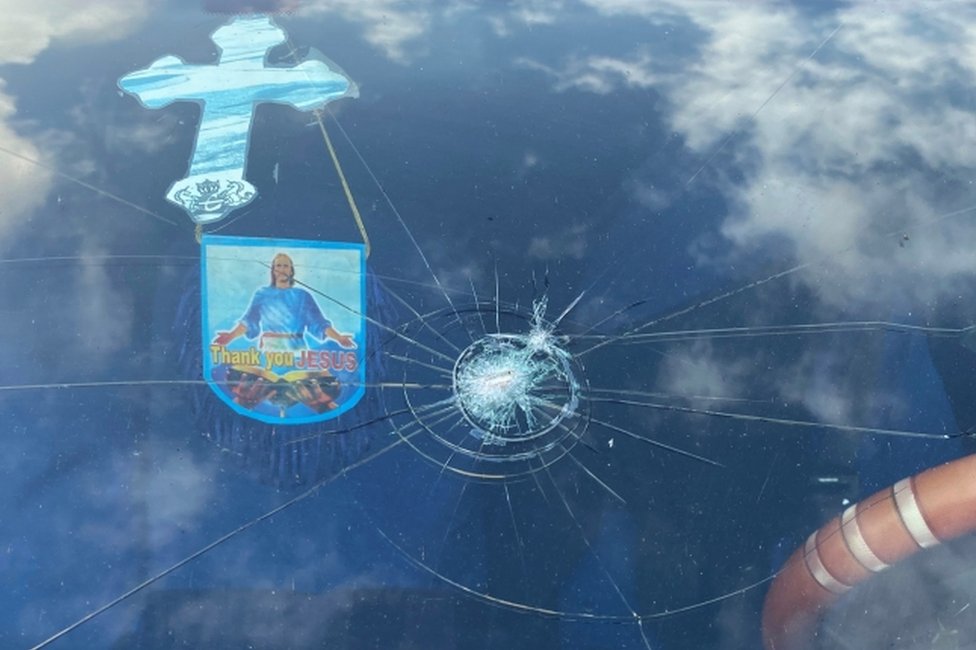 A view shows the damaged window of a car decorated with a cross in Lagos, Nigeria October 22, 2020.