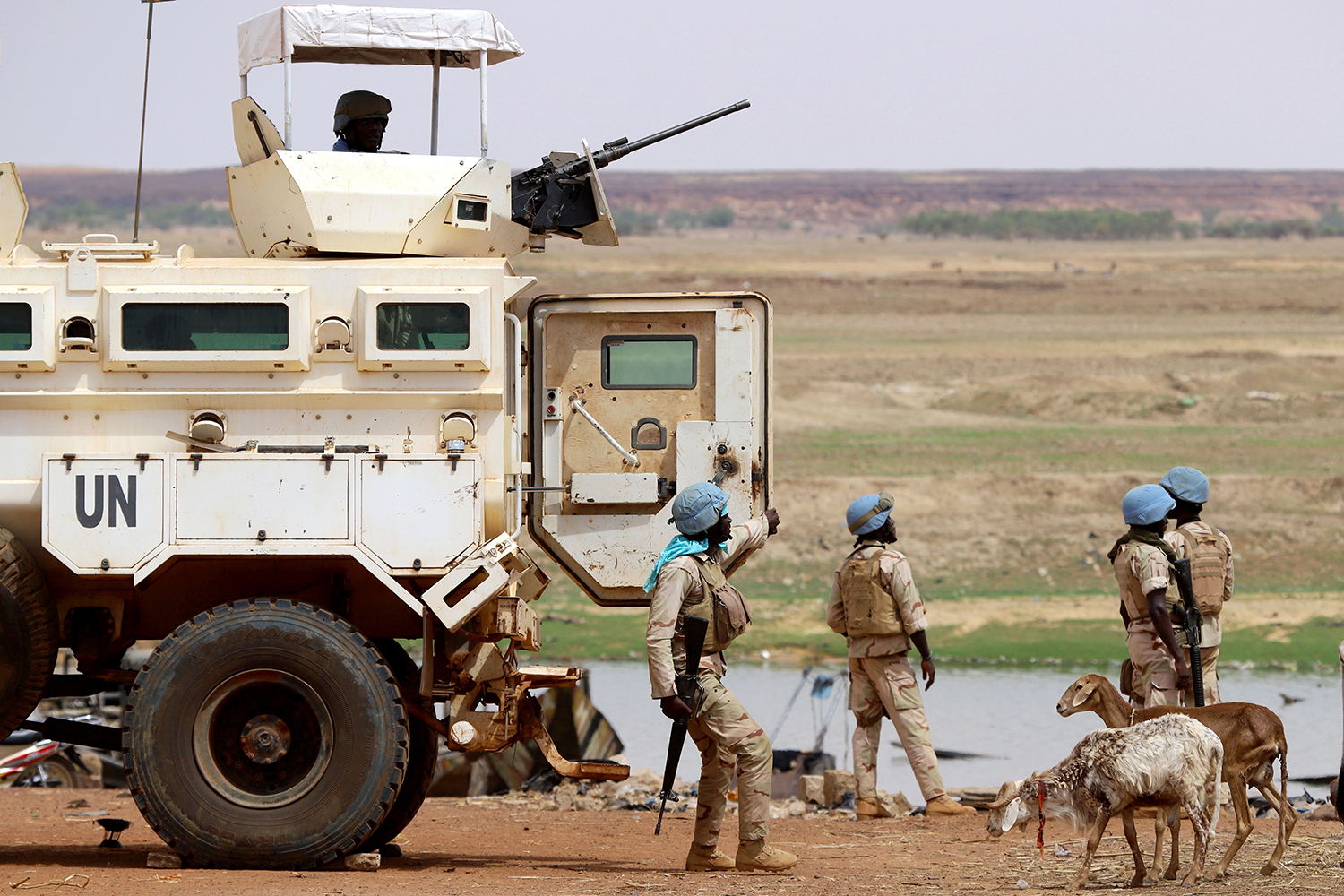 U.N. peacekeepers dismount an armored personnel carrier patrolling in the streets of Gao, Mali, on July 24, 2019, the day after a suicide bombing.