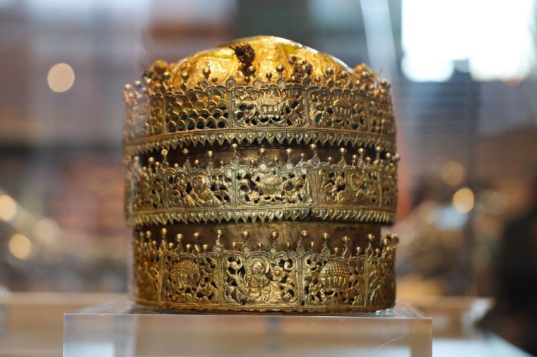 A Crown, made in Ethiopia around 1740, made of gold and gilded copper with glass beads, pigment and fabric is pictured at an exhibition, 